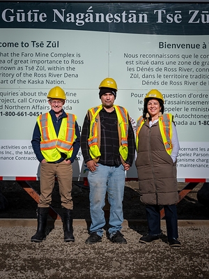 Member of Parliament for the Yukon and Parliamentary Secretary for Northern and Arctic Affairs Dr. Brendan Hanley, Ross River Dena Council Chief Dylan Loblaw, and Northern and Arctic Affairs Minister Rebecca Chartrand at the Faro Mine site. Photo Credit: Peter Mather and Dena Nezziddi Development Corporation