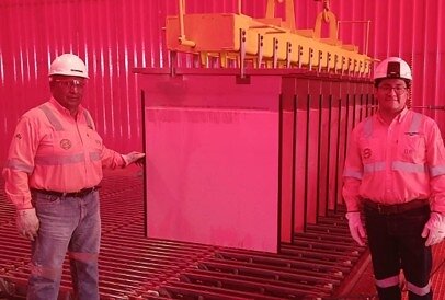 Production of the first copper cathode from oxide ore at the Don Mario Plant on September 16, 2026. The photograph includes EMIPA’s Director of Operations and Project Manager.