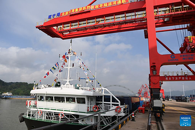 A cargo vessel prepares to depart for Yangpu Port in south China's Hainan Province along the Pinglu Canal at an operation area in Nanning Port, south China's Guangxi Zhuang Autonomous Region, Sept. 16, 2026. China opened a major new canal on Wednesday, giving its landlocked southwest a shortcut to the coast and overseas markets, particularly those in the Association of Southeast Asian Nations (ASEAN), the country's largest trading partner. Built at a cost of 72.7 billion yuan (about 10.75 billion U.S. dollars), the 134.2-kilometer Pinglu Canal runs from Nanning, capital of south China's Guangxi Zhuang Autonomous Region, to the Beibu Gulf, the closest maritime outlet for much of southwest China. (Xinhua/Cao Yiming)