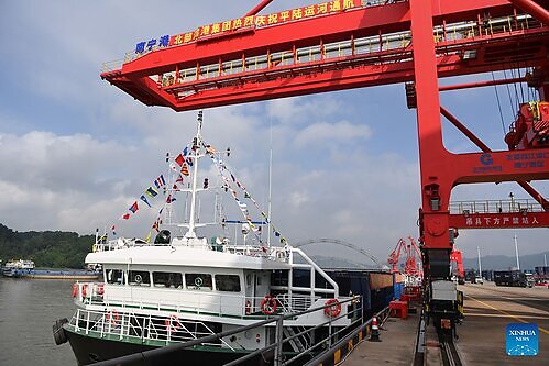 A cargo vessel prepares to depart for Yangpu Port in south China's Hainan Province along the Pinglu Canal at an operation area in Nanning Port, south China's Guangxi Zhuang Autonomous Region, Sept. 16, 2026. China opened a major new canal on Wednesday, giving its landlocked southwest a shortcut to the coast and overseas markets, particularly those in the Association of Southeast Asian Nations (ASEAN), the country's largest trading partner. Built at a cost of 72.7 billion yuan (about 10.75 billion U.S. dollars), the 134.2-kilometer Pinglu Canal runs from Nanning, capital of south China's Guangxi Zhuang Autonomous Region, to the Beibu Gulf, the closest maritime outlet for much of southwest China. (Xinhua/Cao Yiming)