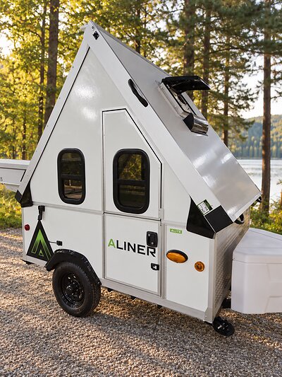 Small footprint. Big invitation. The all-new 2027 Aliner Alite is ready to open the door to your next adventure. Garageable and full height interior when opened. Small footprint. Big invitation. The all-new 2027 Aliner Alite is ready to open the door to your next adventure. Garageable and full height interior when opened.