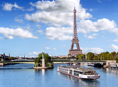In the heart of Paris, France, a Viking river ship sails the Seine River, not far from the Eiffel Tower. In October 2026, Shelby Steudle, president, Pavlus Travel & Cruise, will christen Viking's newest Seine vessel, Viking Fjolvar. Photo by Shutterstock.