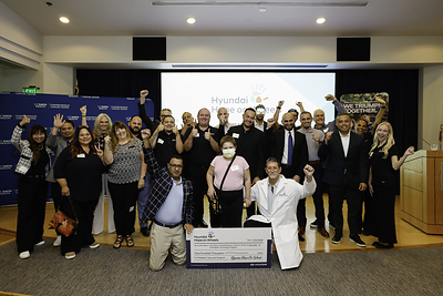 Hyundai presenting a check to UC Davis Comprehensive Cancer Center