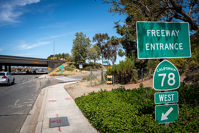 Freeway entrance sign for westbound California Route 78 beside a roadway.