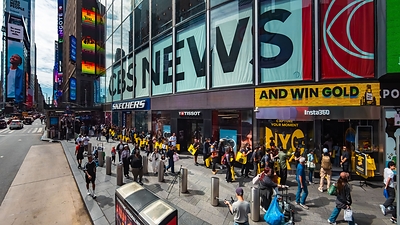 A large group of customers line up outside Insta360's flagship store on opening day.