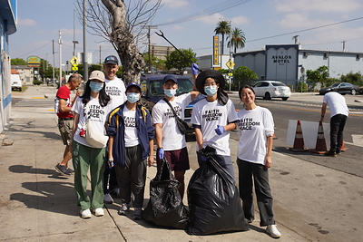 Los Angeles, CA local residents gathered for a neighborhood street cleanup wearing the message "Faith
Freedom Peace.