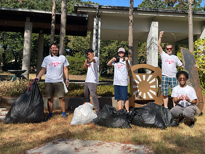 Family Federation volunteers clean up heaps of trash near a high-traffic freeway in Dallas, TX.