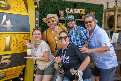 Kentucky Bourbon Festival attendees celebrate after winning a pour of Pappy Van Winkle 12 Year on the World Famous CaskX Bourbon Wheel during the 2026 Kentucky Bourbon Festival in Bardstown, Kentucky.
