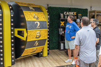 Kentucky Bourbon Festival attendees watch the World Famous CaskX Bourbon Wheel determine their next pour at the CaskX booth during the 2026 festival in Bardstown, Kentucky.