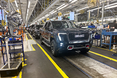 A GMC Sierra EV with battery cells made from recycled materials rolls off the line at GM&rsquo;s Factory ZERO assembly facility.