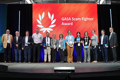 ScamAdviser Head of Growth, Yuying Shih (fifth from the right), receives the Scam Fighter Award for Watchmen at GASS America 2026