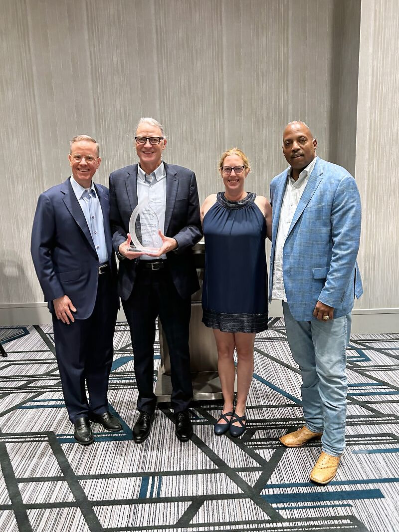 Caracal Presents John Reumann with Glen A. Taylor Excellence in Mentorship Award