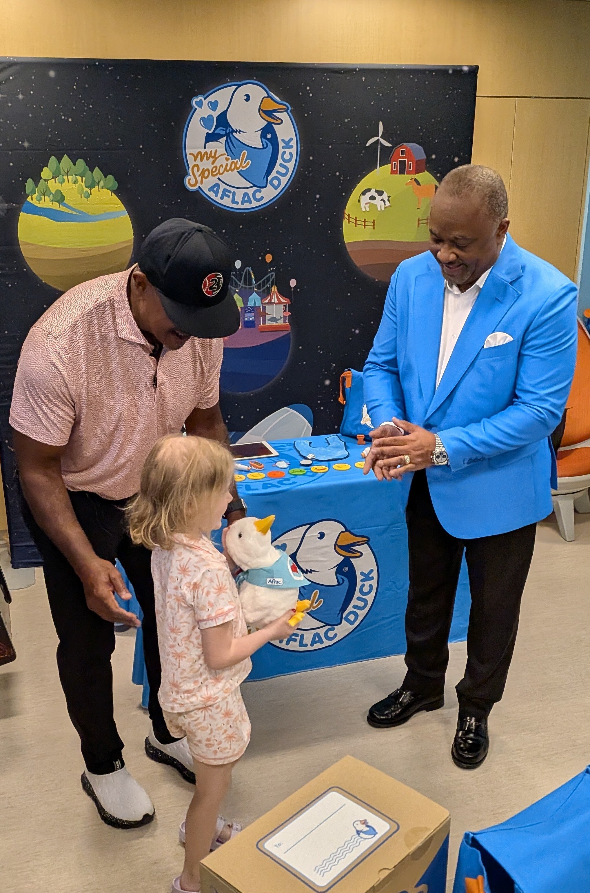 Former baseball and football star Brian Jordan and Aflac President Virgil Miller join forces to show love and care to children and families at SSM Health Cardinal Glennon Children's Hospital in St. Louis