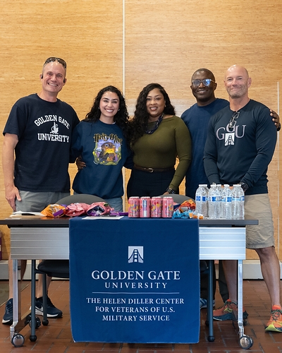 Helen Diller Center for Veterans of U.S. Military Service staff and volunteers staff a promotional table during GGU Campus Week, July 2026.