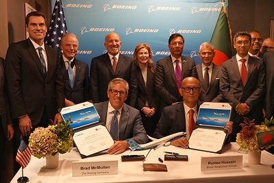 Boeing and Biman Bangladesh leaders today announced the airline ordered 11 more Boeing airplanes. Front, from left: Brad McMullen, Boeing senior vice president of Commercial Sales and Marketing, and Rumee A. Hossain, chairman of Biman Bangladesh Airlines. Back row, from left: William Kimmitt, Under Secretary of Commerce for International Trade; Brendan Nelson, Boeing Global senior vice president; Howard Lutnick, U.S. Secretary of Commerce; Stephanie Pope, Boeing Commercial Airplanes president and CEO; Rashiduzzaman Millat, Bangladesh Minister of Civil Aviation and Tourism; S. Paul Kapur, Assistant Secretary of State for South and Central Asian Affairs; Chowdhury Ashik Mahmud Bin Harun, chairman of Invest Bangladesh Authority; Kaanthi Bhuvanagiri, Boeing sales director for India and South Asia; Paul Righi, Boeing vice president of Commercial Sales and Marketing for Eurasia, India and South Asia.