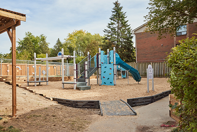 The same spot a few hours later. Foresters Financial employees, KABOOM! and the Maple Glen community built this playground in a single day. The climbing wall, slide and ramped entry began as ideas from the children who live here.