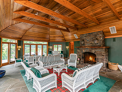 Just off the custom, 50,000-gallon pool is the large pool house. The 1,088-sf structure includes lofted ceilings with exposed wood beams, a fireplace, kitchenette and one (1) full bath. NewJerseyLuxuryAuction.com. Just off the custom, 50,000-gallon pool is the large pool house. The 1,088-sf structure includes lofted ceilings with exposed wood beams, a fireplace, kitchenette and one (1) full bath. NewJerseyLuxuryAuction.com.