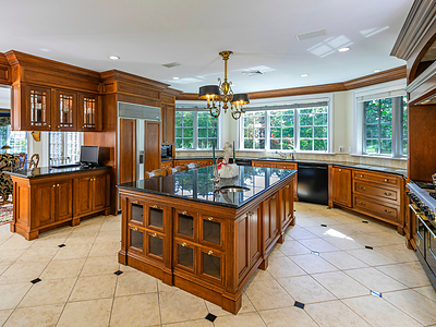 A chef’s kitchen sits at the heart of the home, and features a Viking® gas range, Sub Zero® refrigerator, two (2) dishwashers, large center island, granite countertops, cherry cabinets, walk-in pantry and wet bar. An adjacent breakfast area (not pictured) opens to the patio. NewJerseyLuxuryAuction.com. A chef’s kitchen sits at the heart of the home, and features a Viking® gas range, Sub Zero® refrigerator, two (2) dishwashers, large center island, granite countertops, cherry cabinets, walk-in pantry and wet bar. An adjacent breakfast area (not pictured) opens to the patio. NewJerseyLuxuryAuction.com.