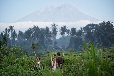 Morning walk with Mount Agung background at The Kayon Gangga Resort.