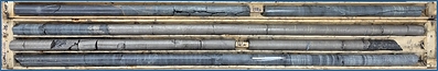 Figure 3: Photograph of the 2.45 meters thick chalcopyrite-bearing massive sulphides, from 159.1 to 161.55 meters, in hole CUP26-010, within a thin sulphide bearing (blebs and disseminations) olivine pyroxenite. The massive sulphides show a sharp lower contact with evidence of xenomelts.