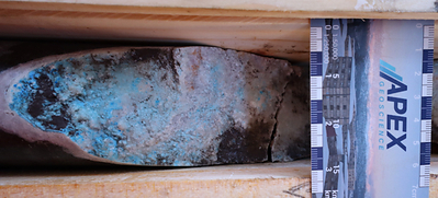 Photo 5: DH26CC-003, 272.2–275.2 m, selected core face with blue-green material consistent with chrysocolla. Visual observations only; assays pending.