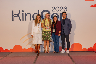 Alyce De La Cruz and Rebekah Kurisu of Hoag Hospital Foundation accepting 2026 Kindness Award from Kindsight's Marie Yatco and George Wu