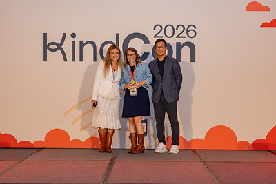 Anida Ho of Wisconsin Foundation & Alumni Association accepting 2026 Kindness Award from Kindsight's Marie Yatco and George Wu
