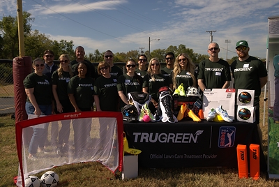 TruGreen volunteers gather around new sports equipment donated to the local community through the company’s partnership with Good Sports and iHeartMedia. TruGreen volunteers gather around new sports equipment donated to the local community through the company’s partnership with Good Sports and iHeartMedia.