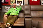 Dan Patrick relaxes on Flexsteel® Pulse™ immersive sound seating in his iconic man cave studio, where the expanded partnership showcases Flexsteel's newest innovation in premium home entertainment.