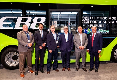 Mr. Robert Hill, VP of E-Bus Sales, VinFast US (far right), Mr. Paul Gioupis, Founder and CEO of ZEEM Solutions (second from right), Mr. Kevin O'Connor, CEO of Transportation Management Services (third from right), along with representatives from both sides at the expo.