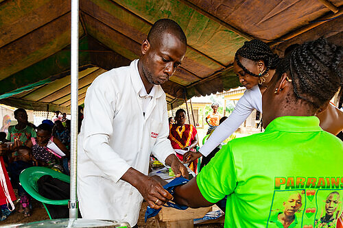 A healthcare worker conducts a blood pressure check during a community health outreach session in Côte d’Ivoire.
Photo: Millequim. Courtesy of Gavi and Bayer Foundation. This image opens in the lightbox