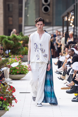 HIROMI ASAI Spring/Summer 2027 "Akatsuki - Before the Dawn," presented at New York Fashion Week in September 2026, featuring a fluid white silhouette with a dramatic trailing panel. HIROMI ASAI Spring/Summer 2027 "Akatsuki - Before the Dawn," presented at New York Fashion Week in September 2026, featuring a fluid white silhouette with a dramatic trailing panel.