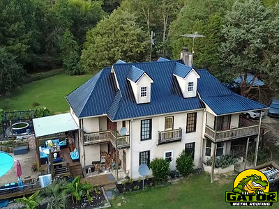 Photograph of new metal roofing on historic-looking Carolina home. Photograph of new metal roofing on historic-looking Carolina home.
