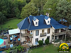 Photograph of new metal roofing on historic-looking Carolina home.