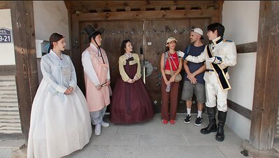 Broadcaster Kwon Hyuk-soo, singer Yujeong and Harin of the global K-pop group KIIRAS talking with foreign tourists from Italy at Gyochon Village in Gyeongju, the millennial ancient capital. Photo: Arirang International Broadcasting This image opens in the lightbox