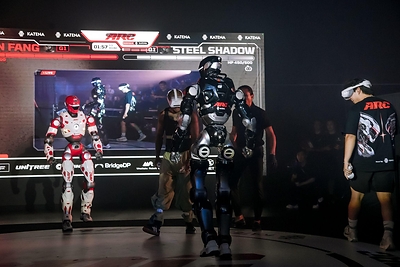 Muay Thai, MMA, boxing and Ninja Kungfu fighters wore body sensors to control lightweight Unitree G1 and heavyweight EngineAI T800 humanoids in real time, the first public demonstration of ARC's pilot-avatar vision for the humanoid age.