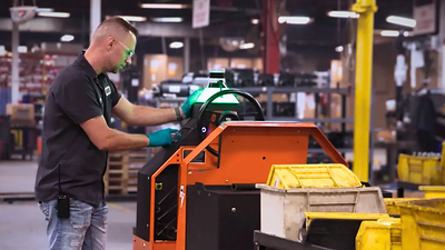 A worker at Coats sends the Autonomous DriveMod Tugger onto a new mission. With EasyLauch, customers are able to deploy autonomous vehicles without needing Capex approval. A worker at Coats sends the Autonomous DriveMod Tugger onto a new mission. With EasyLauch, customers are able to deploy autonomous vehicles without needing Capex approval.