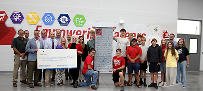 Representatives from Iowa American Water presented staff and students at the North Scott Community School District a $10,000 American Water Charitable Foundation Workforce Readiness grant supporting robotics, LEGO League and hands-on engineering programs at the Regional Innovation Center. In turn, the student presented Iowa American Water with a large thank you display.