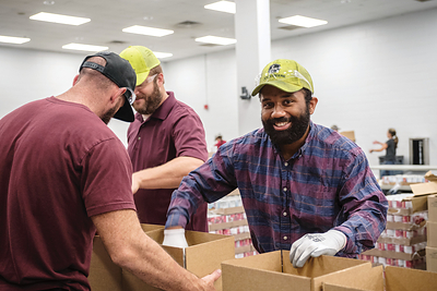 Dedicated funding for annual meal packing events will allow thousands of John Deere employees to support their local food banks during the workday. 