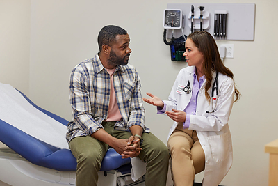 MinuteClinic provider consults with a patient during primary care visit. 