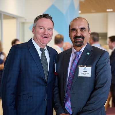Tim Michels, co-owner of the Michels Corporation, and Shekar N. Kurpad, MD, PhD, president and CEO of the Medical College of Wisconsin, celebrate the dedication of the Medical College of Wisconsin Michels Center for Cancer Discovery on October 12, 2026. Tim Michels, co-owner of the Michels Corporation, and Shekar N. Kurpad, MD, PhD, president and CEO of the Medical College of Wisconsin, celebrate the dedication of the Medical College of Wisconsin Michels Center for Cancer Discovery on October 12, 2026.