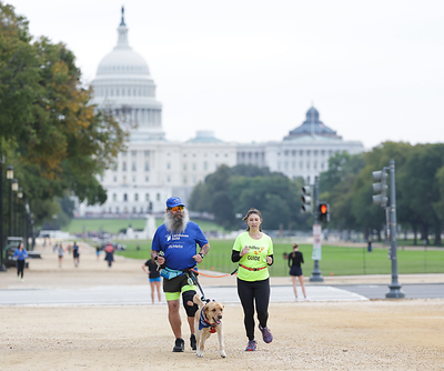 Thomas Panek, Lighthouse Guild President & CEO, running with Kelly Ingham, Vice President of AI Wearables and Research Partnerships, and Achilles guide Adam Foutz Thomas Panek, Lighthouse Guild President & CEO, running with Kelly Ingham, Vice President of AI Wearables and Research Partnerships, and Achilles guide Adam Foutz