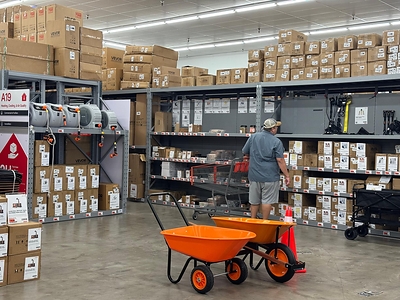 A shopper browses the aisles of VEVOR's Houston store, surrounded by seasonal tools and equipment for fall home projects. A shopper browses the aisles of VEVOR's Houston store, surrounded by seasonal tools and equipment for fall home projects.