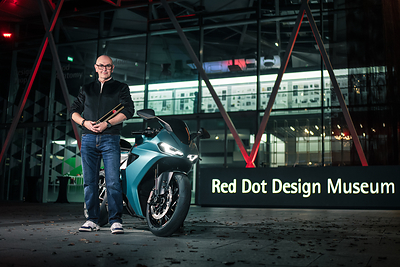 Simon Skinner, Head of Design at Norton Motorcycles, with the Norton Manx R at the Red Dot Design Museum Singapore