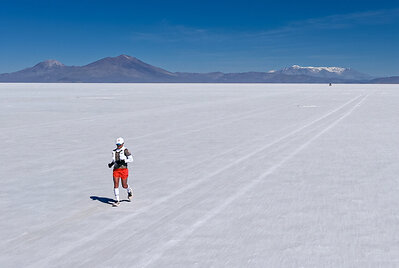 Fernanda Maciel running across the Salar de Uyuni during her record crossing attempt, in Uyuni, Bolivia, on September 28, 2026. This image opens in the lightbox