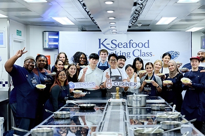 Lead Chef Leo Kang (center), along with the chefs and participants of the K-Seafood Cooking Class