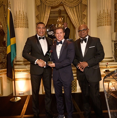 Jamaica's Prime Minister, Dr. the Most Honourable Andrew Holness; Adam Stewart, CD, Hon. LLD, Executive Chairman of Sandals and Beaches Resorts; and Jamaica's Minister of Tourism, the Honourable Edmund Bartlett, OJ, CD, MP, at the AFJ Hummingbird Gala at The Plaza Hotel in New York City.