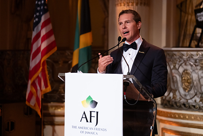 Adam Stewart, Executive Chairman of Sandals and Beaches Resorts, expressing his gratitude and pride in Jamaica as he accepts the AFJ International Achievement Award at the Hummingbird Gala.