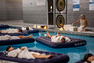 Crystal bowls guide guests afloat in the pool during The Parkside Spa’s signature Drift Float Sound Bath.