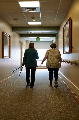 Dr. Piquet walking with a patient from the clinical trial